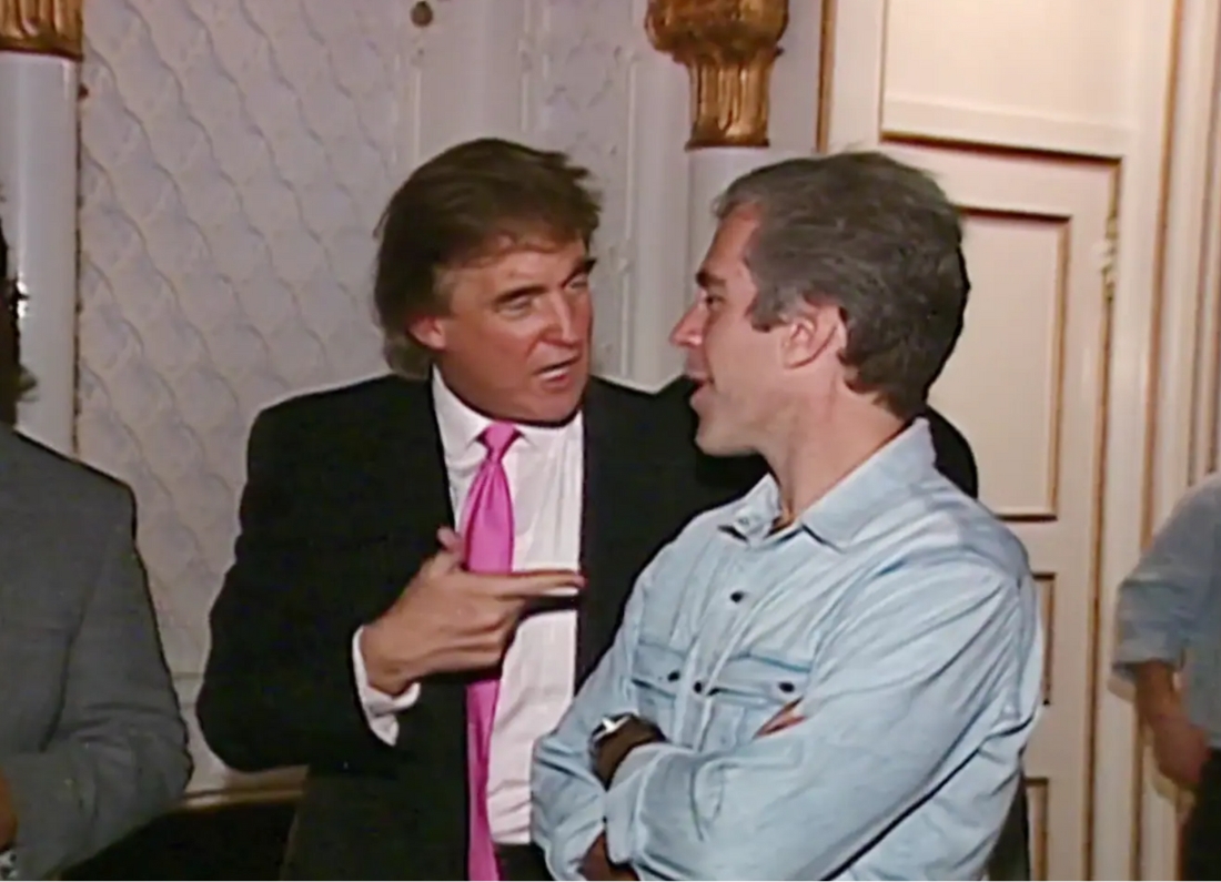 Donald Trump and Jeffrey Epstein speak at a party at Mar-a-Lago in November 1992 in Palm Beach, Fla.