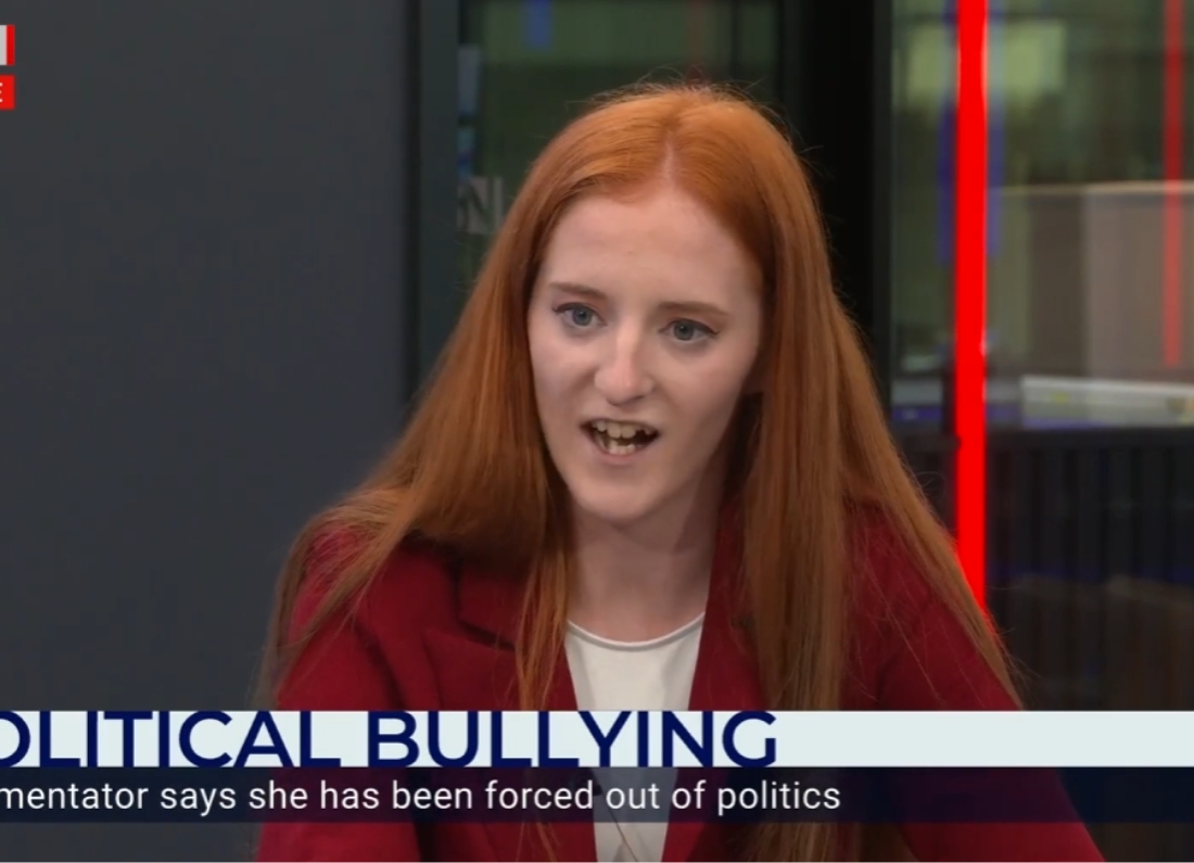 Sophie Corcoran speaking during a TV interview segment about political bullying.