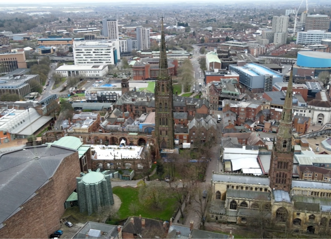 Aerial view of Coventry city centre showing Coventry Cathedral, church spires and surrounding buildings.
