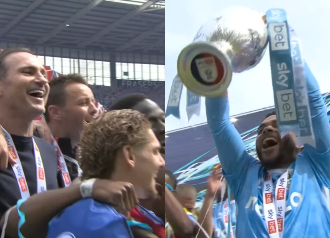 Coventry City players celebrate together as one lifts the Championship trophy with Sky Bet ribbons.