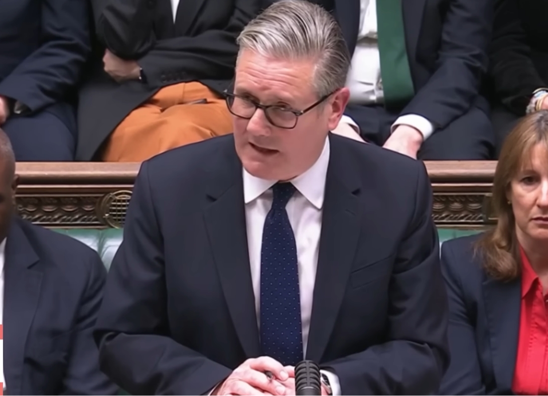 Prime Minister Keir Starmer speaking at the House of Commons dispatch box during parliamentary proceedings.