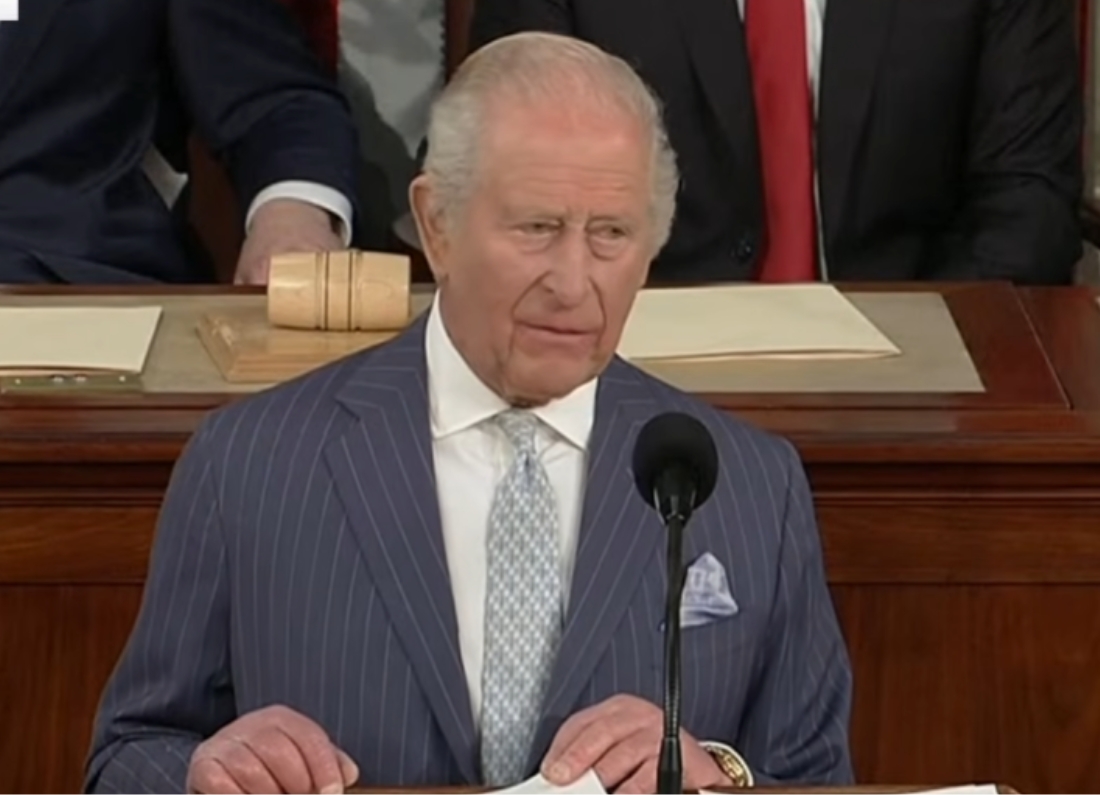 King Charles III delivers a speech at a podium inside the US Congress chamber.