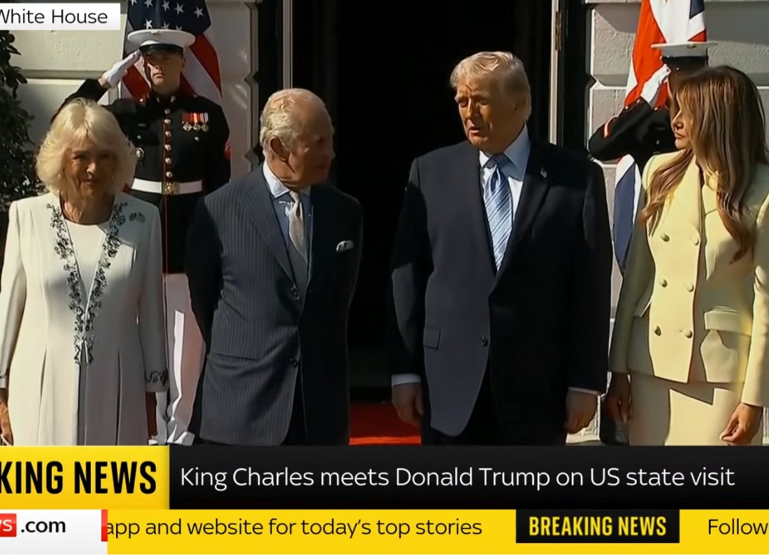 King Charles III and Queen Camilla stand with Donald Trump and Melania Trump outside the White House during a ceremonial welcome.