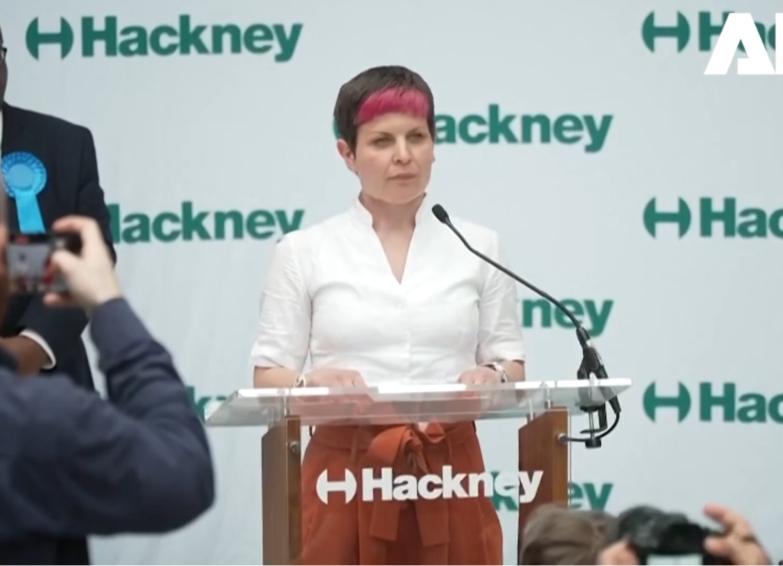 Zoë Garbett speaks at a podium after winning the Hackney mayoral election.