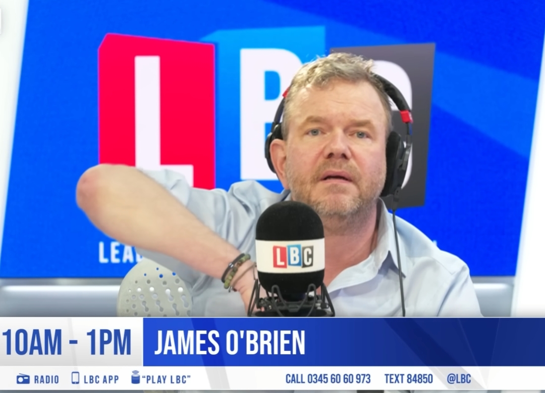 LBC presenter James O’Brien speaks into a microphone while broadcasting live from the radio station’s studio.