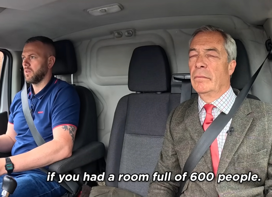 Reform UK leader Nigel Farage sits in the passenger seat of a van beside Makerfield by-election candidate Robert Kenyon, who is driving during a filmed campaign conversation.