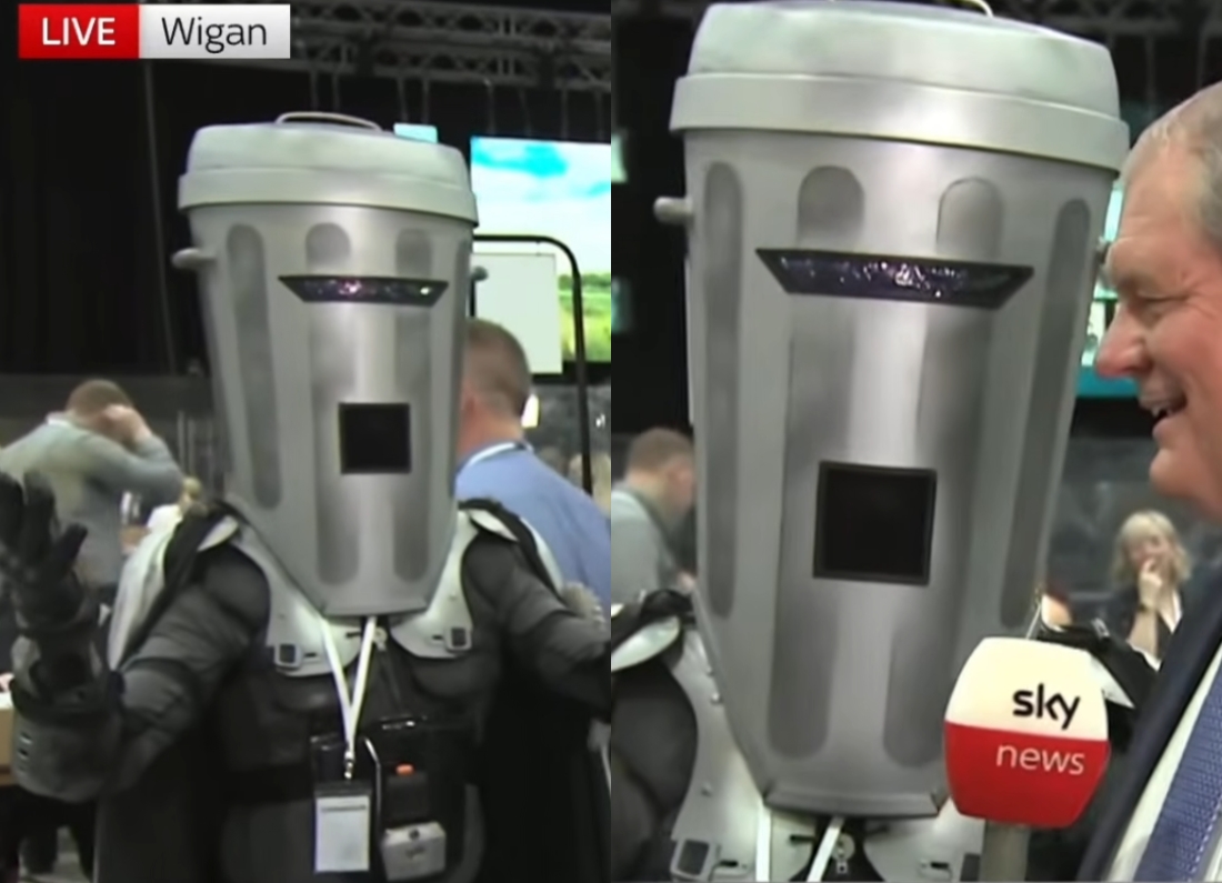 Count Binface, wearing his trademark bin-shaped costume, speaks to Sky News during the Makerfield by-election count.