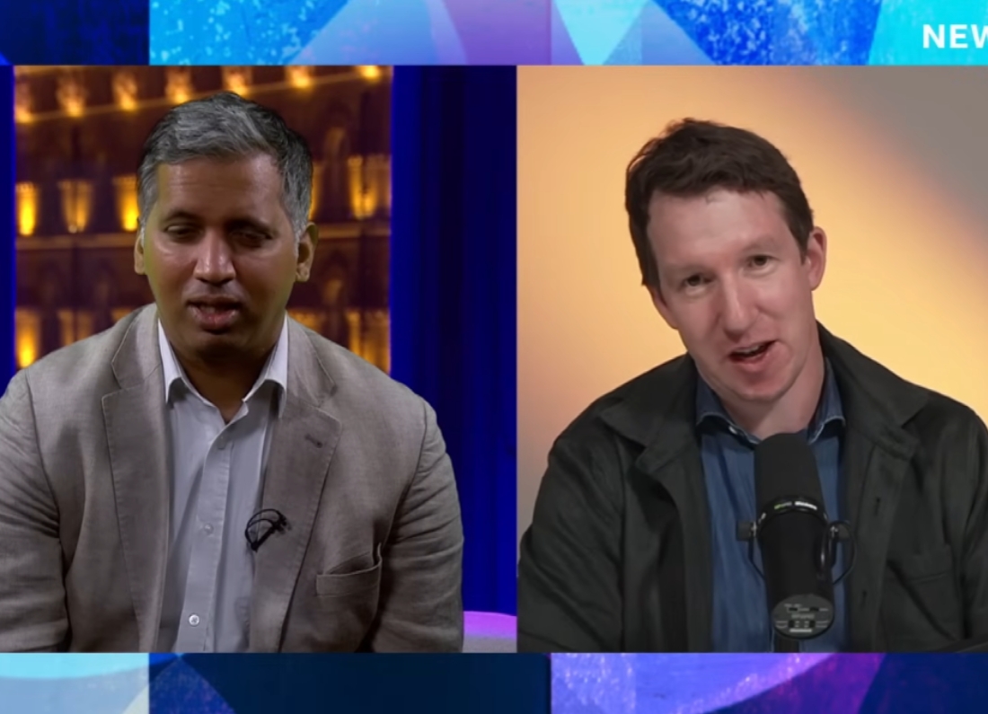 The image shows Faisal Islam on the left in a BBC Newsnight studio, wearing a light-coloured blazer and shirt. On the right, Jack Clark appears remotely in front of a microphone, wearing a dark jacket and blue shirt. Both men are engaged in a discussion about artificial intelligence. The split-screen format highlights the interview setting, with Clark explaining concerns about future AI development and the need for safeguards as systems become more capable and autonomous.