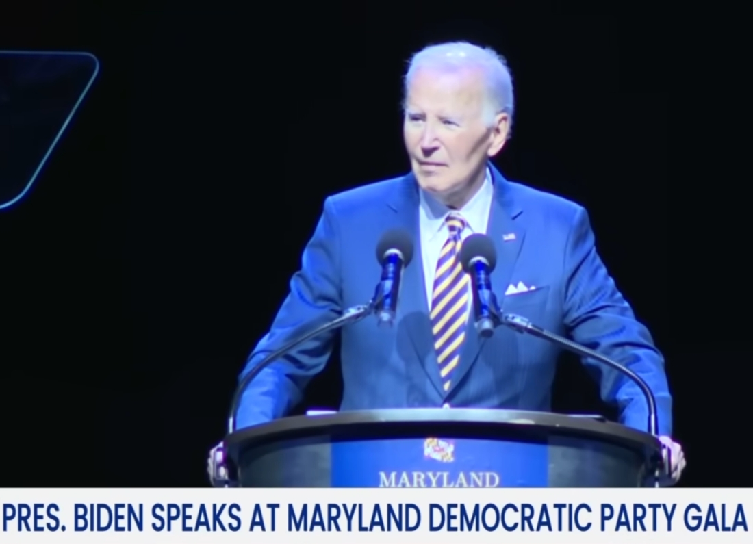 Joe Biden speaking at a podium during the Maryland Democratic Party Gala.