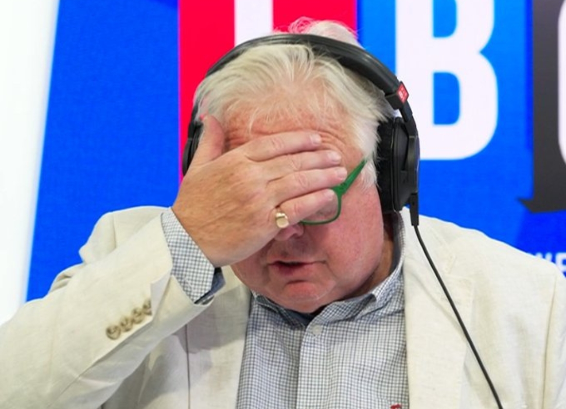 Nick Ferrari in the LBC studio with his hand over his face during a segment about the UK heatwave.