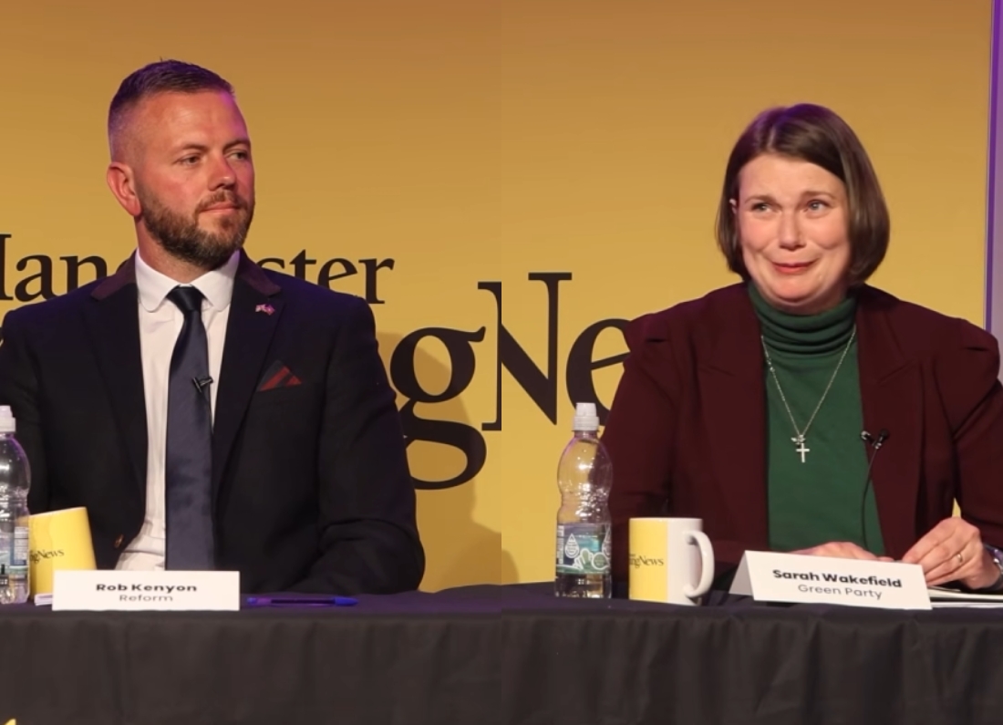 Reform UK candidate Robert Kenyon and Green Party candidate Sarah Wakefield sit on a panel during a by-election debate, with microphones and nameplates visible on the table.