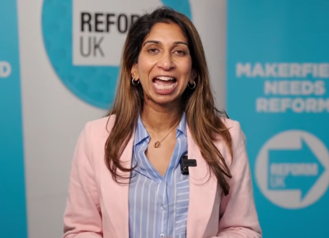 Suella Braverman speaks in front of Reform UK campaign branding during a video message about family and employment policies.