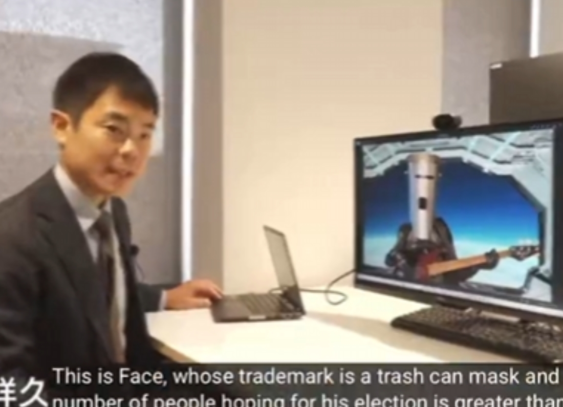 Japanese television presenters discussing Nigel Farage and Count Binface during a report about the Clacton by-election.