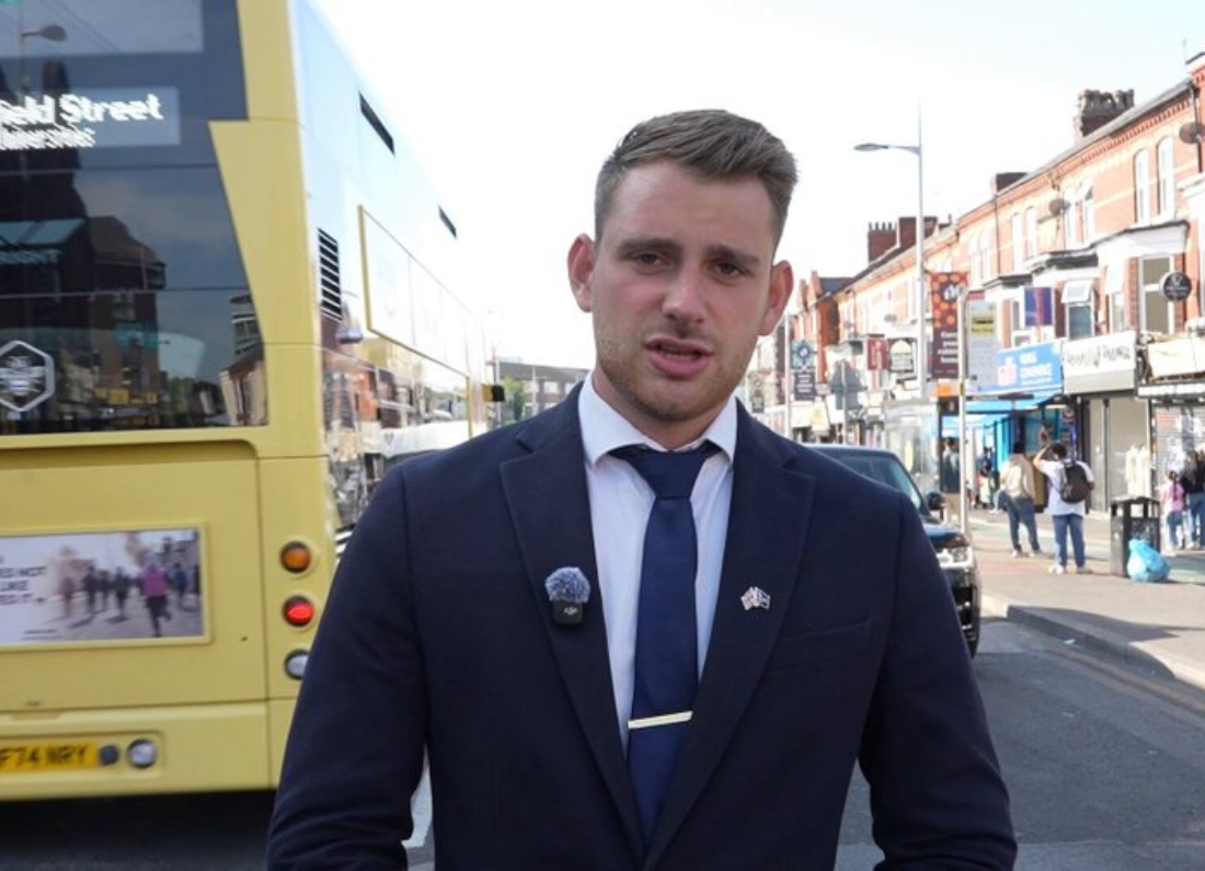 Restore Britain campaigner Montgomery Toms recording a video on Manchester’s Curry Mile in Rusholme.