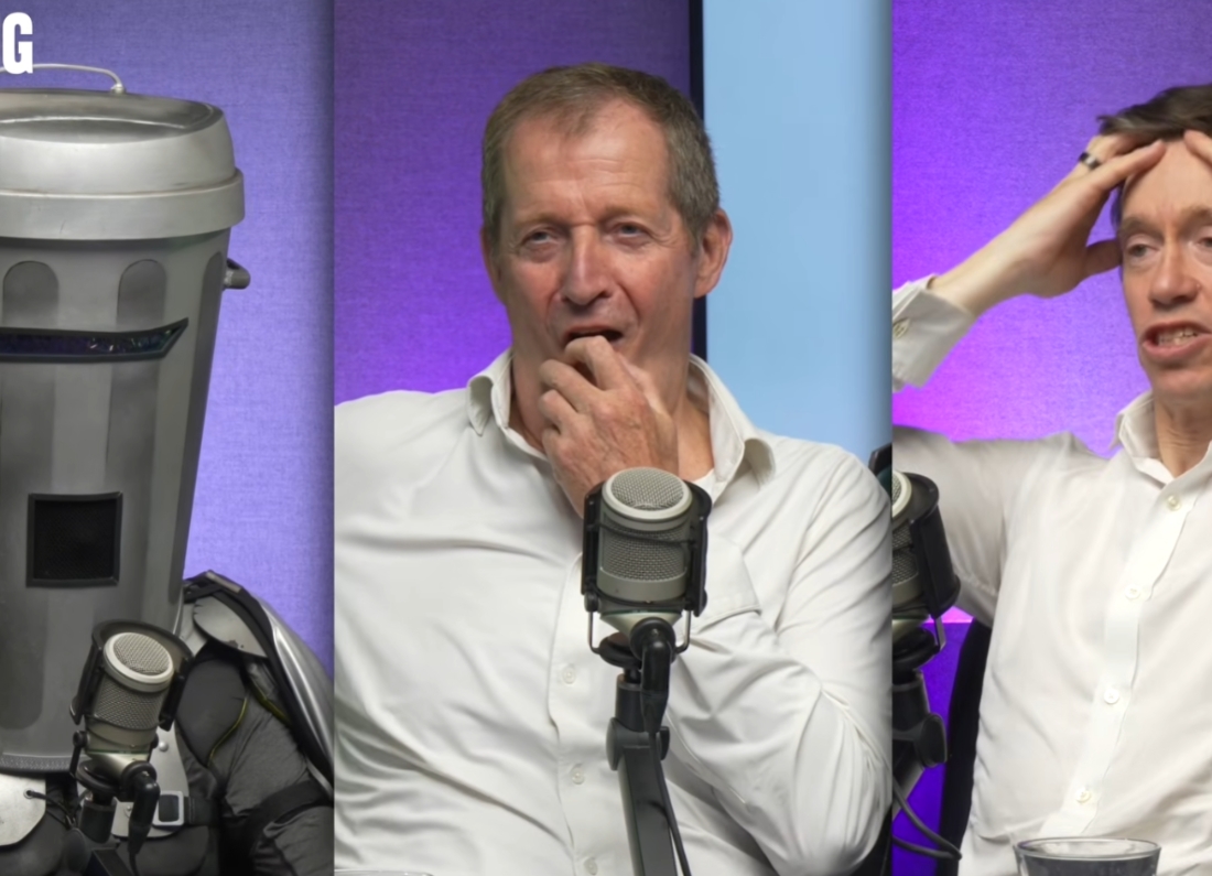 Count Binface appearing with Alastair Campbell and Rory Stewart on The Rest Is Politics. Image title: Count Binface interviewed by Rory Stewart and Alastair Campbell