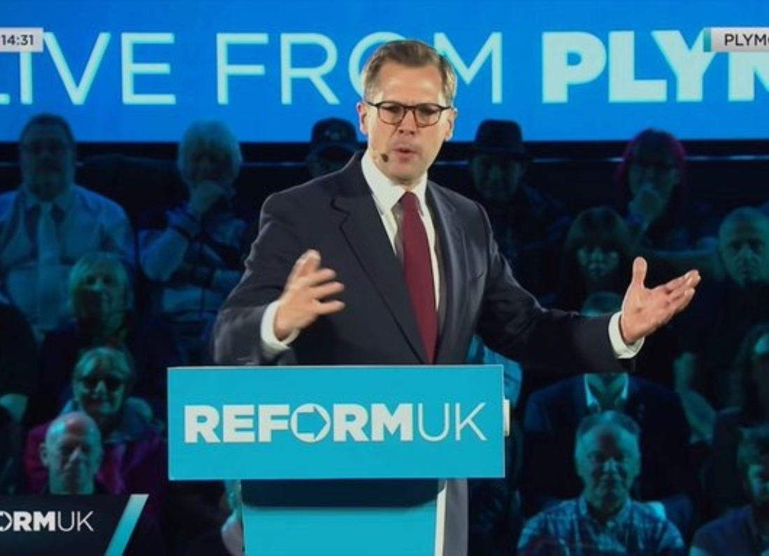 Robert Jenrick addressing Reform UK supporters at a political event in Plymouth.