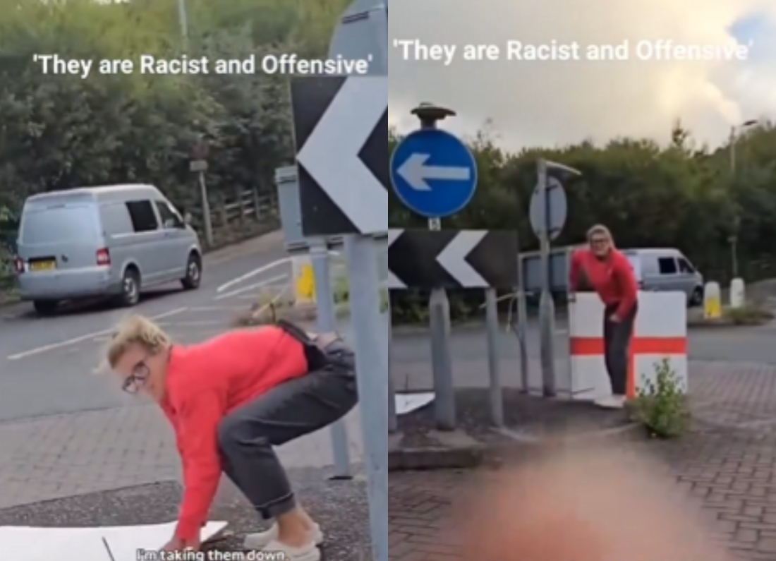 A woman removing a St George’s Cross from a roundabout during a confrontation filmed and shared on social media.